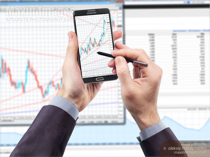 Stock photo of Samsung Galaxy Note III smartphone with stock charts Buy commercial use license at MaximImages