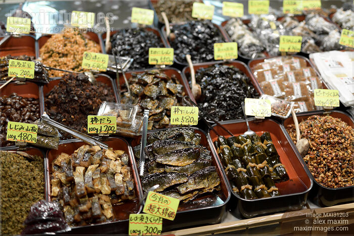 Seafood smoked fish at a street food market stall in Japan Stock photo of Seafood smoked fish at a street food market stall in Japan Buy commercial use license at MaximImages