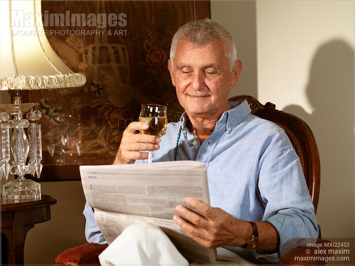 Stock photo of Senior Reading a Newspaper Buy commercial use license at MaximImages