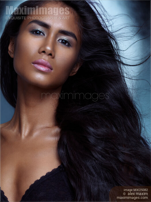 Sensual beauty portrait of a young woman with long hair Stock photo of Sensual beauty portrait of a young woman with long hair Buy commercial use license at MaximImages