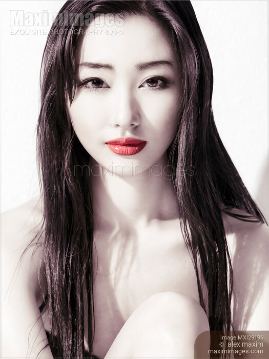 Sensual beauty portrait of young asian woman face with red lips Stock photo of Sensual beauty portrait of young asian woman face with red lips Buy commercial use license at MaximImages