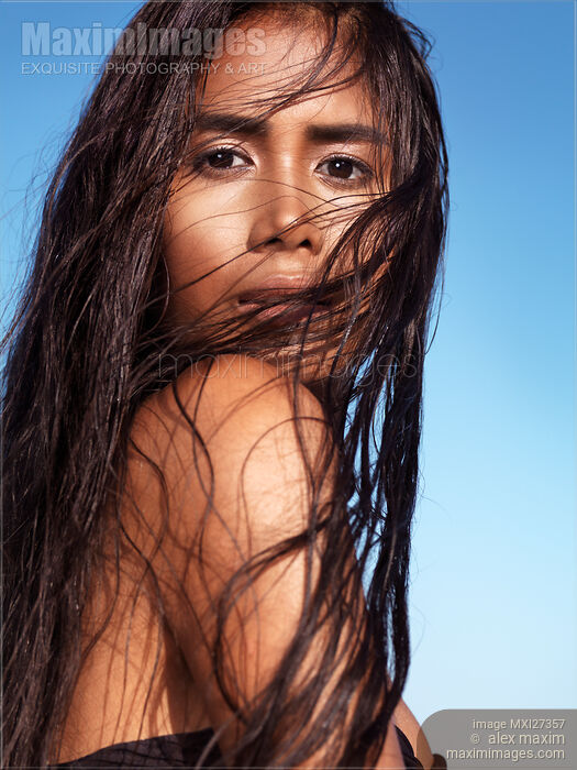 Sensual beauty portrait of young exotic woman with long wet dark hair Stock photo of Sensual beauty portrait of young exotic woman with long wet dark hair Buy commercial use license at MaximImages