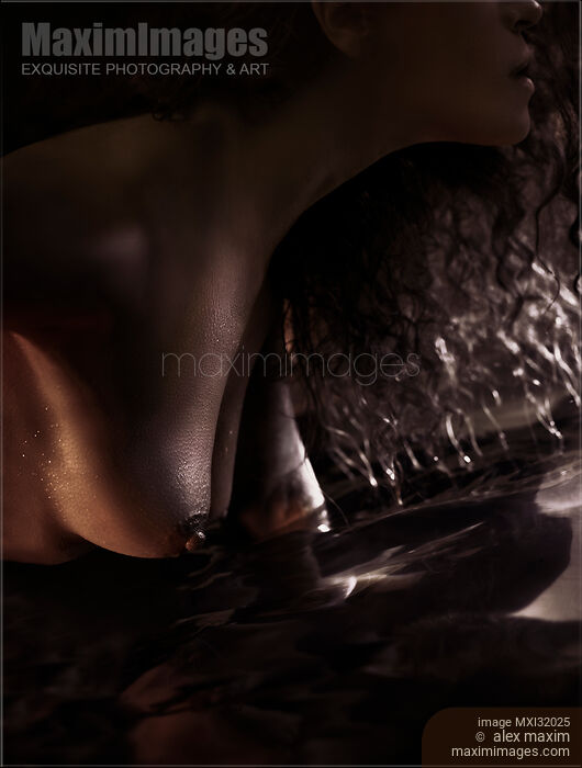 Sensual closeup of nude woman breasts touching water Stock photo of Sensual closeup of nude woman breasts touching water Buy commercial use license at MaximImages