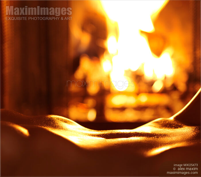 Stock photo of Sensual closeup of nude woman in front of fireplace Buy commercial use license at MaximImages