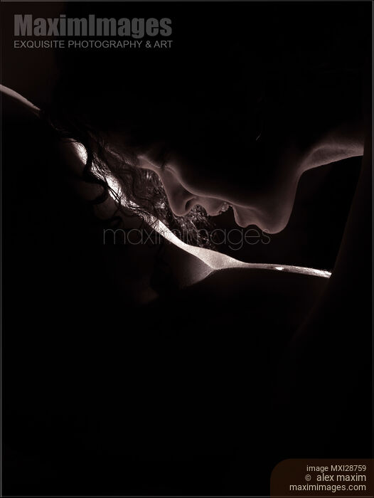 Sensual closeup of woman face kissing man nude body Stock photo of Sensual closeup of woman face kissing man nude body Buy commercial use license at MaximImages