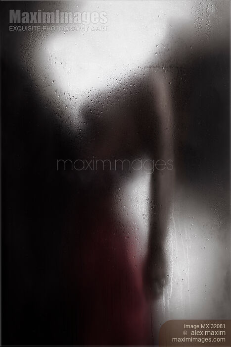 Sensual couple behind wet glass man holding a woman by the waist Stock photo of Sensual couple behind wet glass man holding a woman by the waist Buy commercial use license at MaximImages