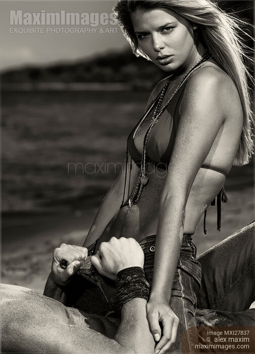 Sensual dramatic black and white portrait of a sexy couple at a sandy beach Stock photo of Sensual dramatic black and white portrait of a sexy couple at a sandy beach Buy commercial use license at MaximImages