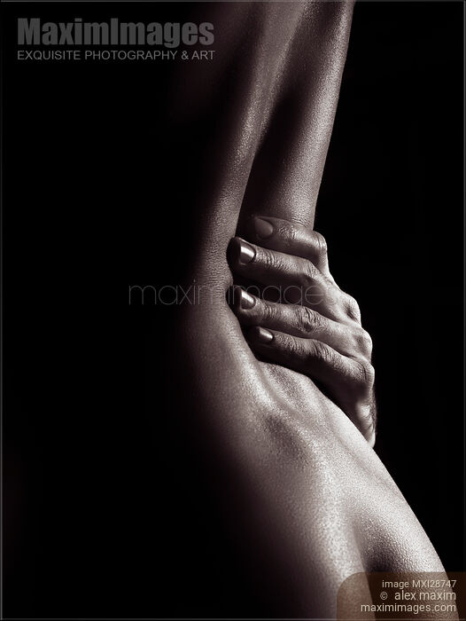 Sensual erotic closeup nude woman body with man hand on her waist Stock photo of Sensual erotic closeup nude woman body with man hand on her waist Buy commercial use license at MaximImages