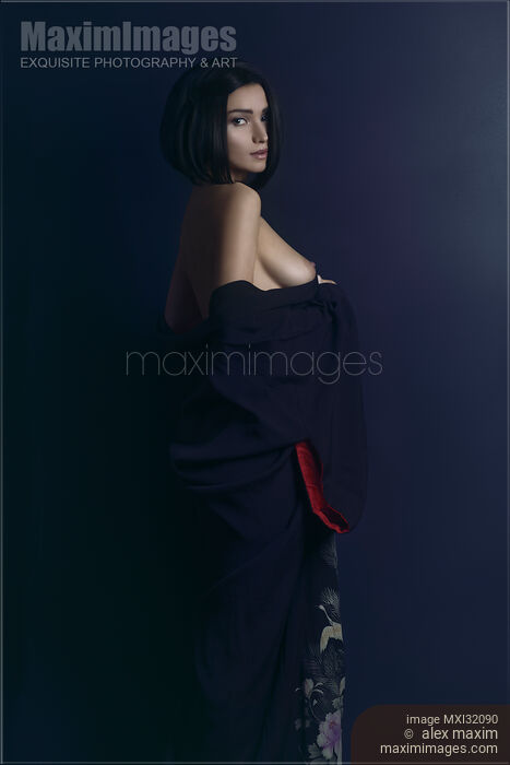 Sensual portrait of a beautiful woman with short black hair and expressive look baring her breasts Stock photo of Sensual portrait of a beautiful woman with short black hair and expressive look baring her breasts Buy commercial use license at MaximImages