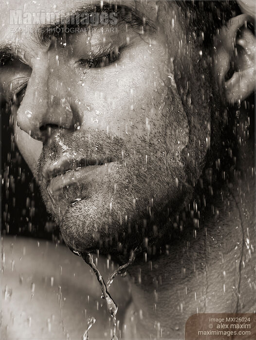 Sensual portrait of man face under pouring water Black and white Stock photo of Sensual portrait of man face under pouring water Black and white Buy commercial use license at MaximImages