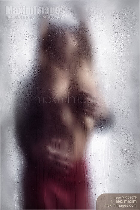 Sexy couple behind wet glass Man hands caressing beautiful half naked woman body Stock photo of Sexy couple behind wet glass Man hands caressing beautiful half naked woman body Buy commercial use license at MaximImages