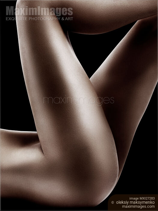 Sexy nude woman legs on black Stock photo of Sexy nude woman legs on black Buy commercial use license at MaximImages