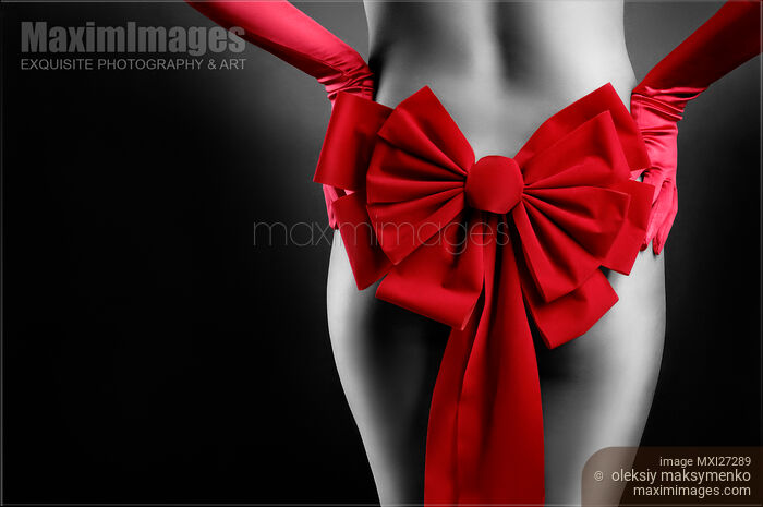 Sexy woman body with red Christmas bow Stock photo of Sexy woman body with red Christmas bow Buy commercial use license at MaximImages