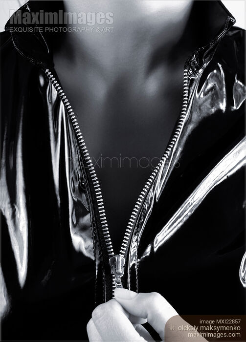 Sexy Woman Unzipping Her Jacket Stock photo of Sexy Woman Unzipping Her Jacket Buy commercial use license at MaximImages