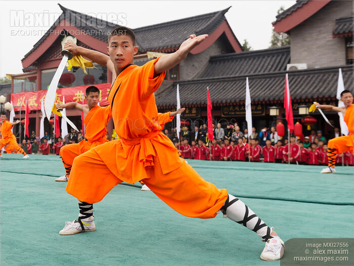 Shaolin Kung Fu student performing with broad sword Stock photo of Shaolin Kung Fu student performing with broad sword Buy commercial use license at MaximImages