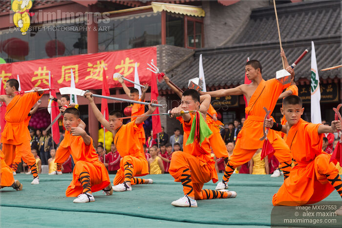 Shaolin Kung Fu student performing with weapons Stock photo of Shaolin Kung Fu student performing with weapons Buy commercial use license at MaximImages