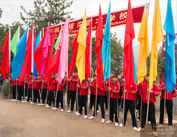 Stock photo of Shaolin martial arts school Tagou students with flags of their school Buy commercial use license at MaximImages