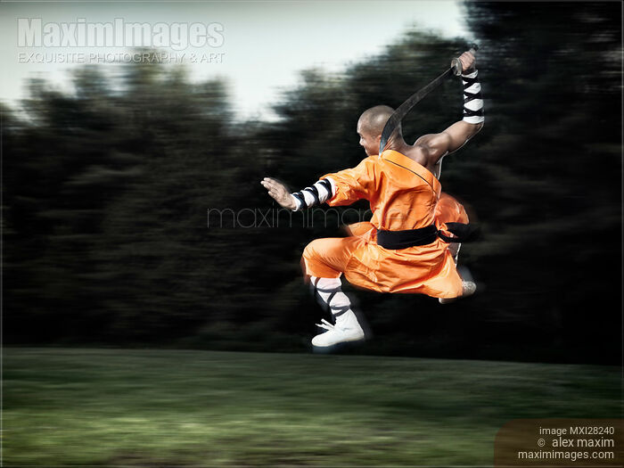Shaolin warrior monk martial artist in mid-air with a sword Stock photo of Shaolin warrior monk martial artist in mid-air with a sword Buy commercial use license at MaximImages
