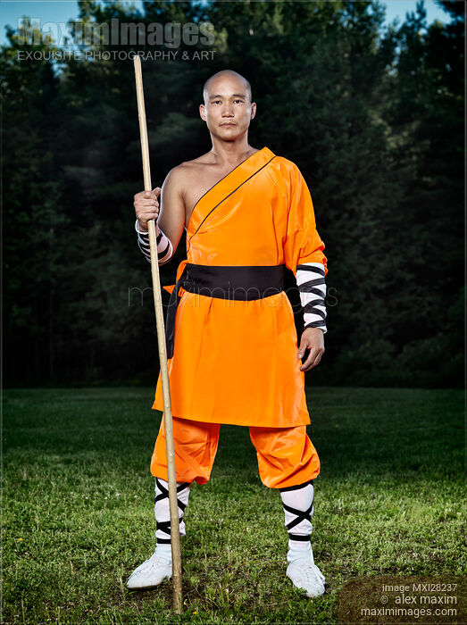 Stock photo of Shaolin warrior monk with a staff Buy commercial use license at MaximImages