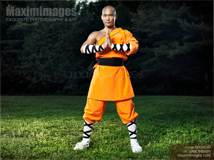 Shaolin warrior monk with hands in lotus position Stock photo of Shaolin warrior monk with hands in lotus position Buy commercial use license at MaximImages