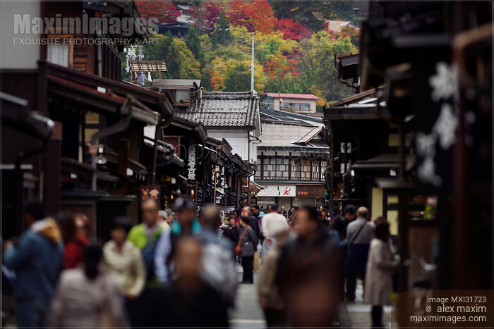 Stock photo of Shops and restaurants at Kami-Sannomachi old town street busy with tourists in Takayama Japan Buy commercial use license at MaximImages