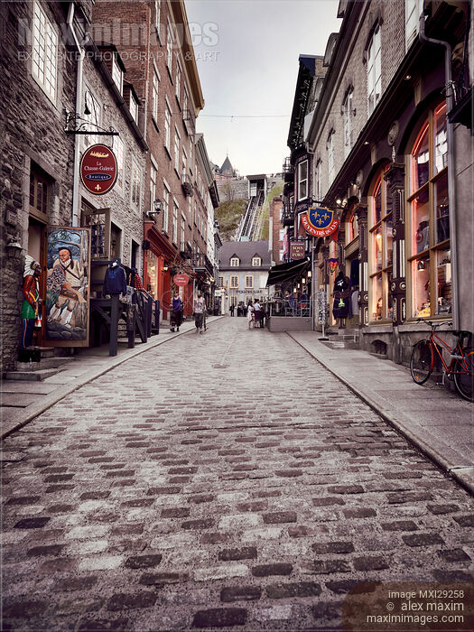 Shops and restaurants on historic street Rue Sous Le Fort of Old Quebec City Stock photo of Shops and restaurants on historic street Rue Sous Le Fort of Old Quebec City Buy commercial use license at MaximImages