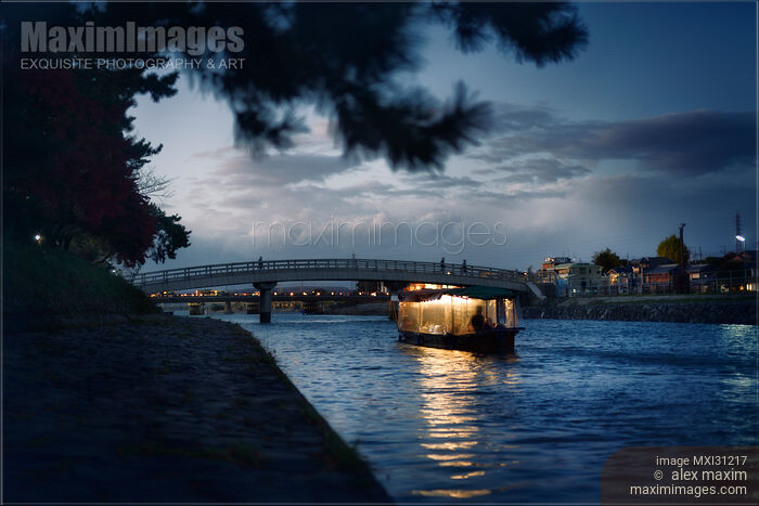 Sightseeing pleasure cruise boat illuminated with lights on Uji River at night Stock photo of Sightseeing pleasure cruise boat illuminated with lights on Uji River at night Buy commercial use license at MaximImages