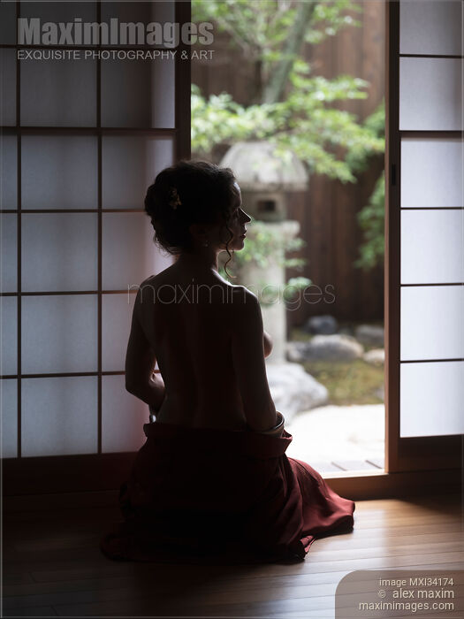 Stock photo of Silhouette of a beautiful woman with naked back sitting by an open door of a Japanese house with Zen garden Buy commercial use license at MaximImages
