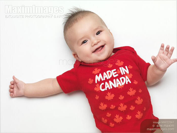 Stock photo of Smiling Baby Wearing Made in Canada Outfit Buy commercial use license at MaximImages