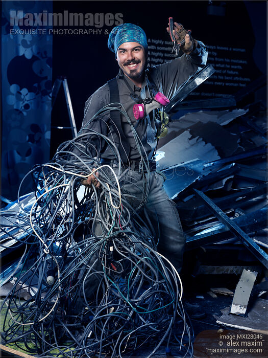 Stock photo of Smiling contractor electrician at work Buy commercial use license at MaximImages
