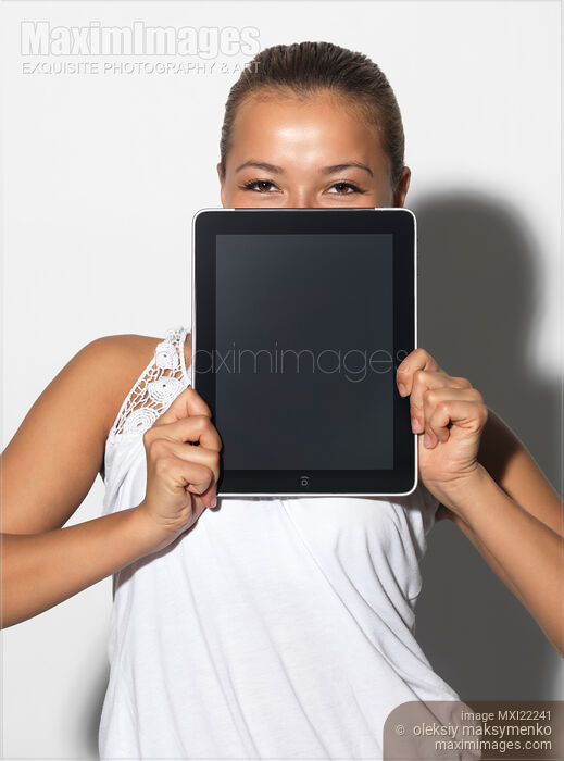 Stock photo of Smiling Girl with Apple iPad 3G Tablet Buy commercial use license at MaximImages