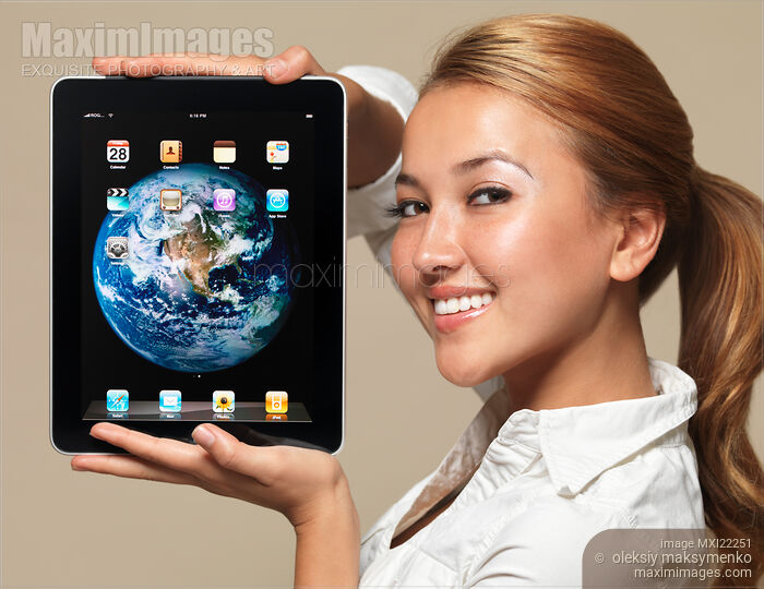 Smiling Girl with Apple iPad 3G Tablet Stock photo of Smiling Girl with Apple iPad 3G Tablet Buy commercial use license at MaximImages