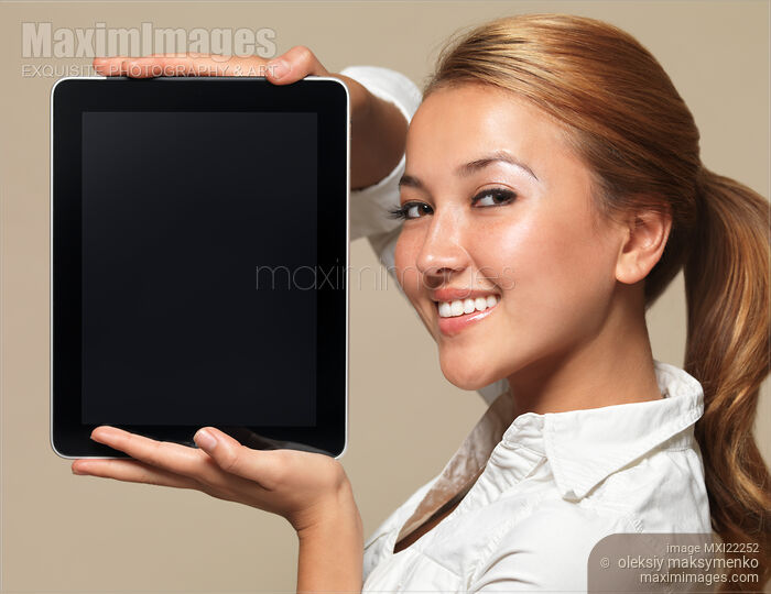 Stock photo of Smiling Girl with Apple iPad 3G Tablet Buy commercial use license at MaximImages