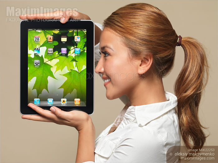 Smiling Girl with Apple iPad 3G Tablet Stock photo of Smiling Girl with Apple iPad 3G Tablet Buy commercial use license at MaximImages