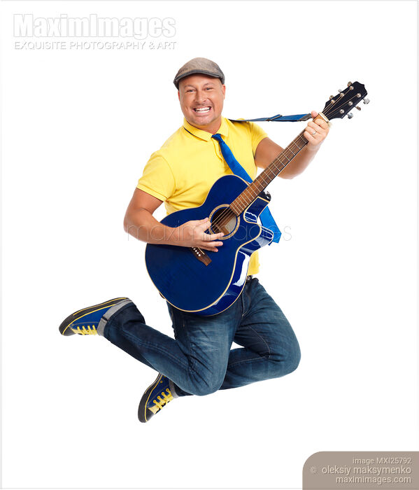 Stock photo of Smiling man with a guitar jumping in the air Buy commercial use license at MaximImages