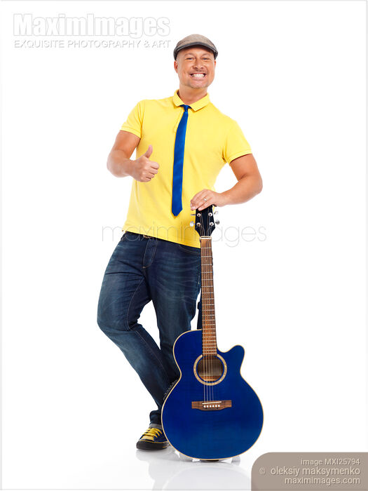 Stock photo of Smiling man with a guitar showing thumbs up Buy commercial use license at MaximImages
