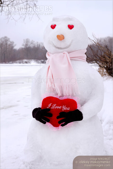 Smiling Snowman in With a Valentine in Hands Stock photo of Smiling Snowman in With a Valentine in Hands Buy commercial use license at MaximImages