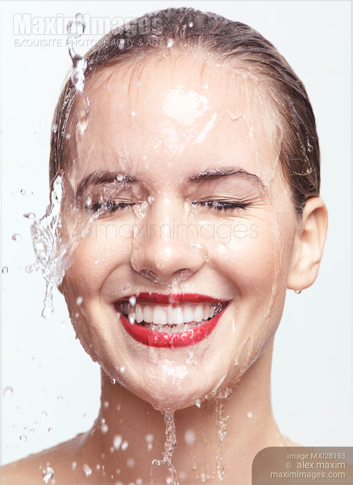 Smiling woman face with red lipstick and dripping water Artistic beauty portrait Stock photo of Smiling woman face with red lipstick and dripping water Artistic beauty portrait Buy commercial use license at MaximImages