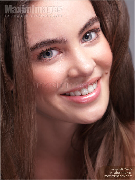 Smiling young woman closeup of face Stock photo of Smiling young woman closeup of face Buy commercial use license at MaximImages