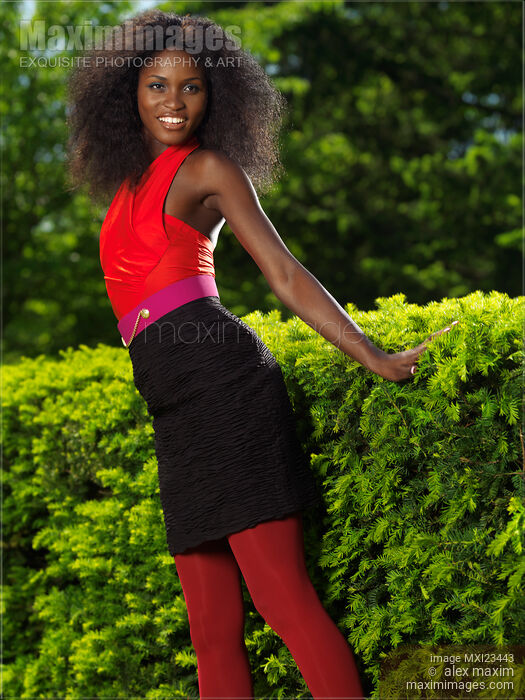 Smiling Young Woman in a park Stock photo of Smiling Young Woman in a park Buy commercial use license at MaximImages