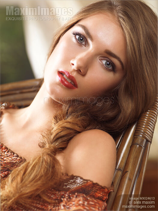 Soft romantic portrait of a young woman in a rocking chair Stock photo of Soft romantic portrait of a young woman in a rocking chair Buy commercial use license at MaximImages
