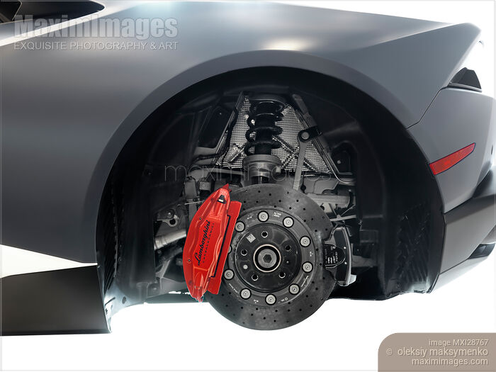 Stock photo of Sports car performance brakes ceramic disc and caliper Buy commercial use license at MaximImages