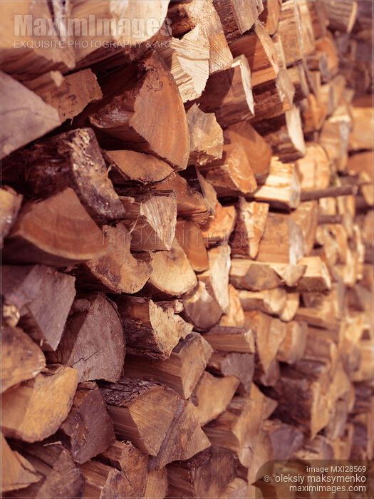 Stock photo of Stacked firewood background Buy commercial use license at MaximImages