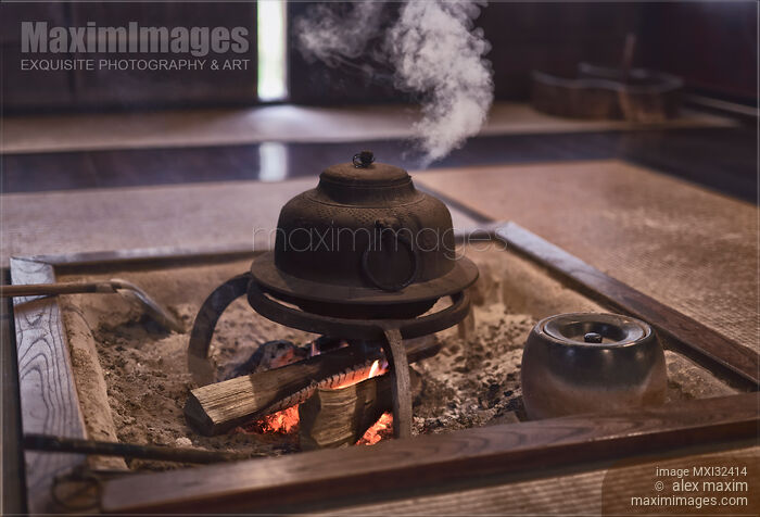 Stock photo of Steaming cast iron kettle Kama on firewood in a Japanese tea house Buy commercial use license at MaximImages