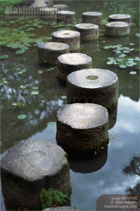 Stock photo of Stepping stones across a pond in a Zen garden Japan Buy commercial use license at MaximImages