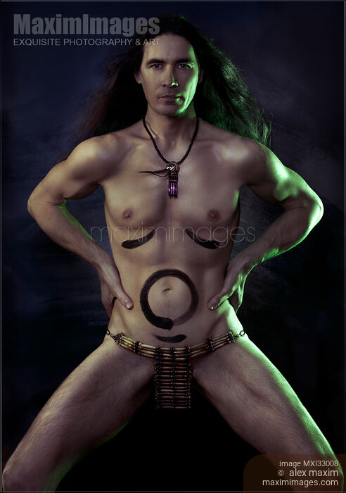 Strong fearless man shamanic warrior fine art portrait with naked painted body expressing creative tantric energy of the universe Stock photo of Strong fearless man shamanic warrior fine art portrait with naked painted body expressing creative tantric energy of the universe Buy commercial use license at MaximImages