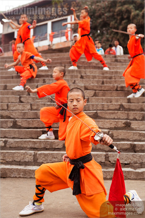 Students of Shaolin Kung Fu school performing with weapons in DengFeng Stock photo of Students of Shaolin Kung Fu school performing with weapons in DengFeng Buy commercial use license at MaximImages