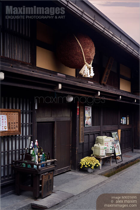 Stock photo of Sugidama cedar ball with Shinto rope hanging above the entrance of a sake brewery in Takayama Gifu Japan Buy commercial use license at MaximImages