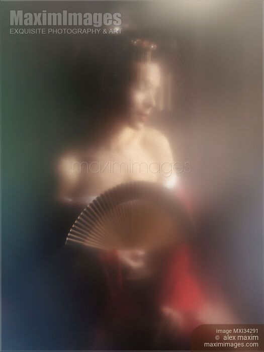 Stock photo of Surreal portrait of beautiful Japanese geisha or courtesan with sensually bared shoulders behind misty glass Buy commercial use license at MaximImages