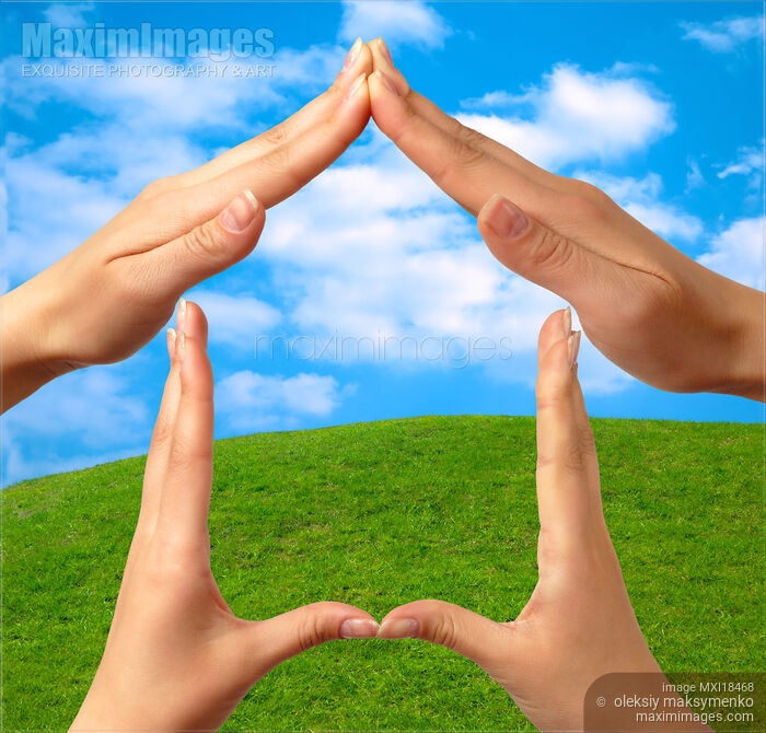 Stock photo of Symbol home over green summer landscape Buy commercial use license at MaximImages